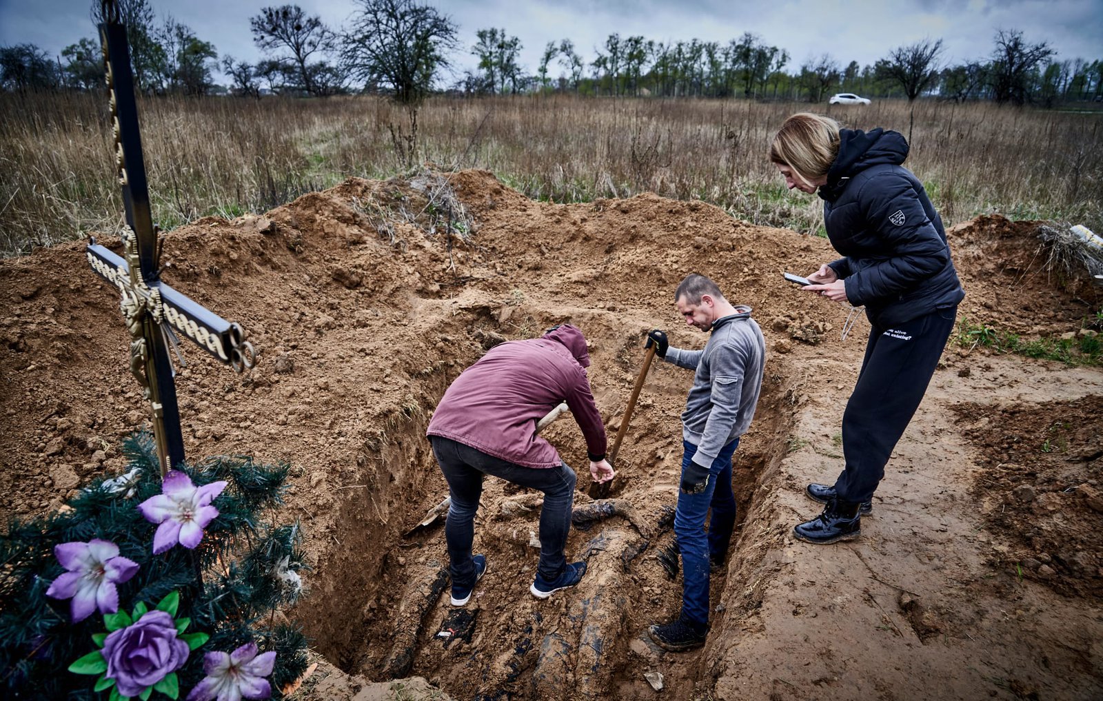 The unearthing of a mass grave in Borodyanka on April 26, 2022. Out of the five bodies one is identified. A few days later, another man was able to identify his son.
