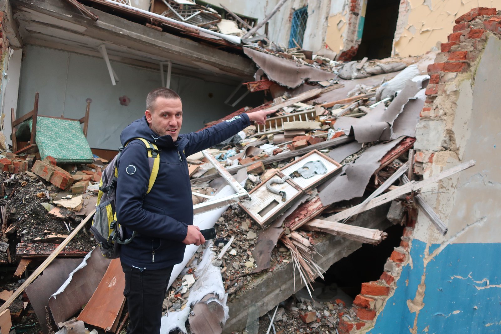 Mykola Topol shows the place where he had been rescued