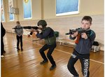 Попередній перегляд The 49th Radio Engineering Brigade practicing an AK shooting stance with children