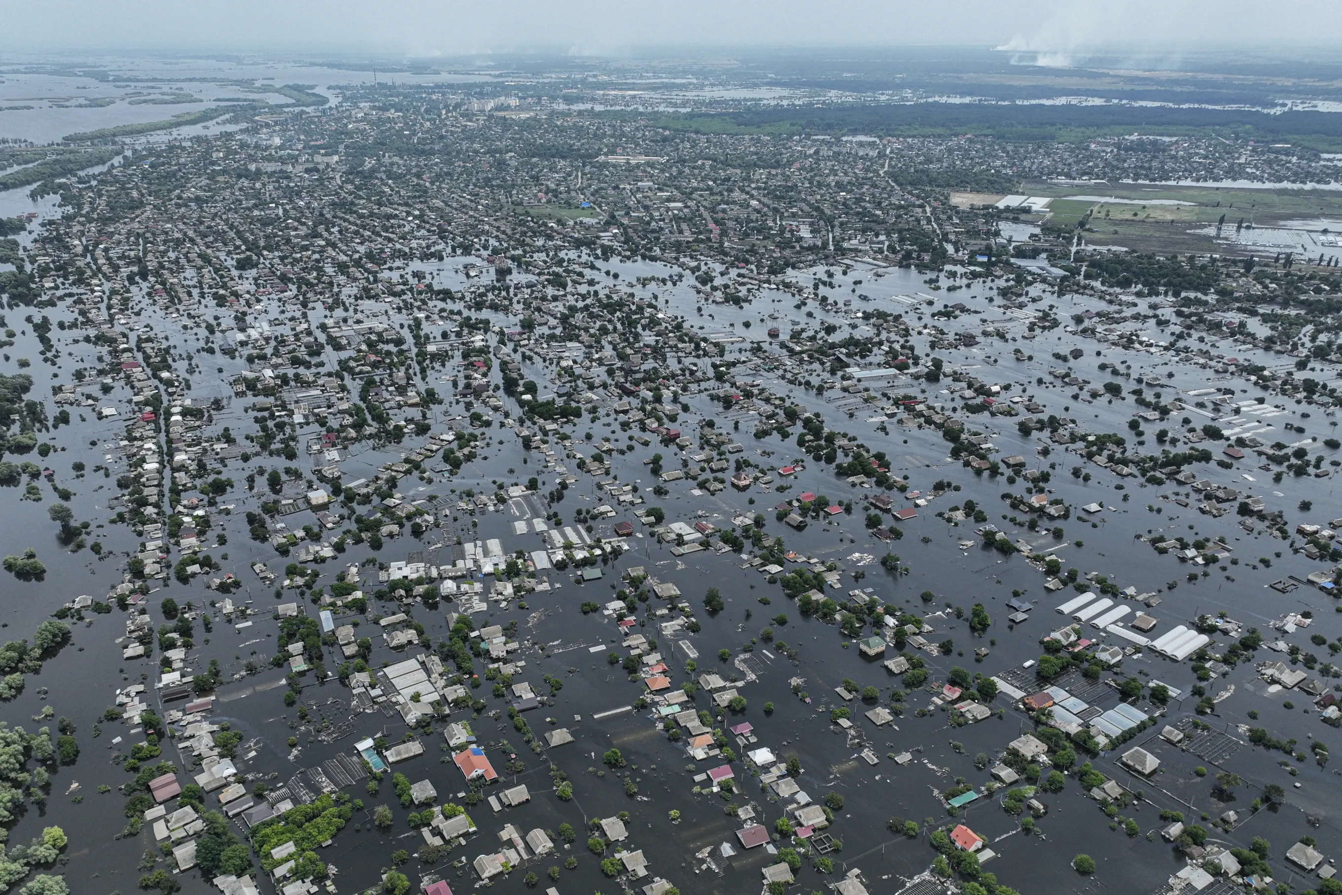 Houses are seen underwater in the flooded town of Oleshky, Ukraine, June 10, 2023. Photo: AP